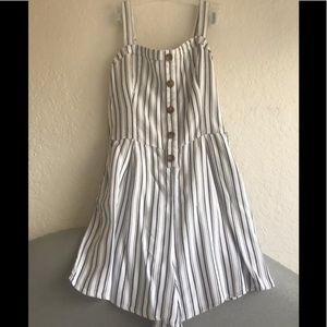 Black and white striped romper with brown buttons